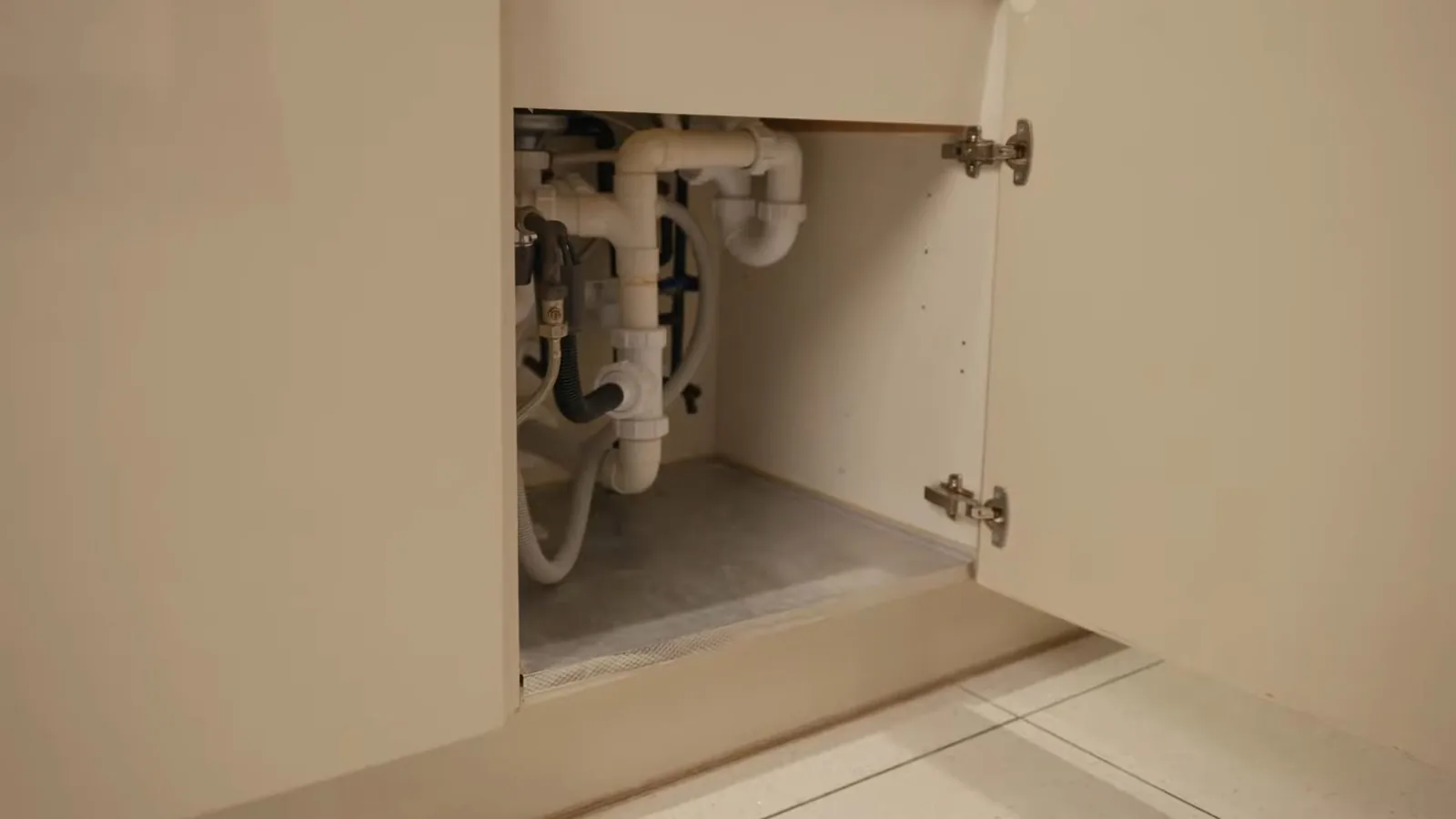 An under-sink water filter connected below a kitchen sink, illustrating Earthy Taste in Alpharetta Tap Water? What MIB and Geosmin Actually Mean