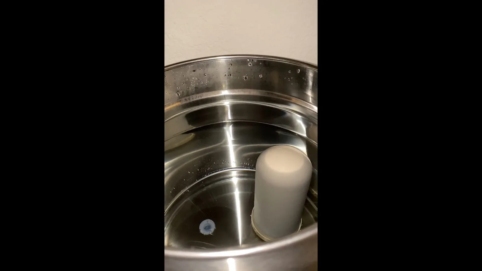 An under-sink water filter connected below a kitchen sink on a plumbing call in Roswell, GA