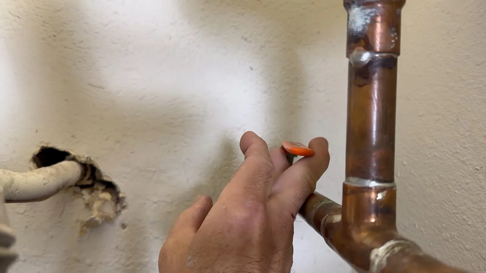 A moisture meter reading taken near a suspected leak during Leak Detection service in Alpharetta
