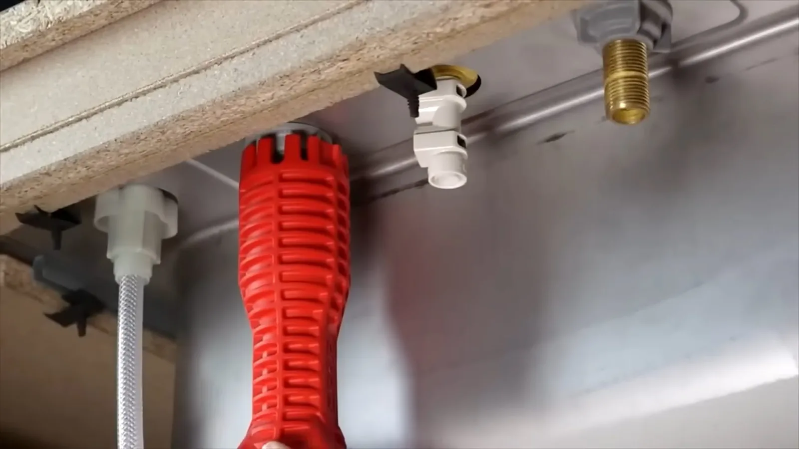 A cracked fitting removed after a hard freeze, representing 24/7 Emergency Plumber service